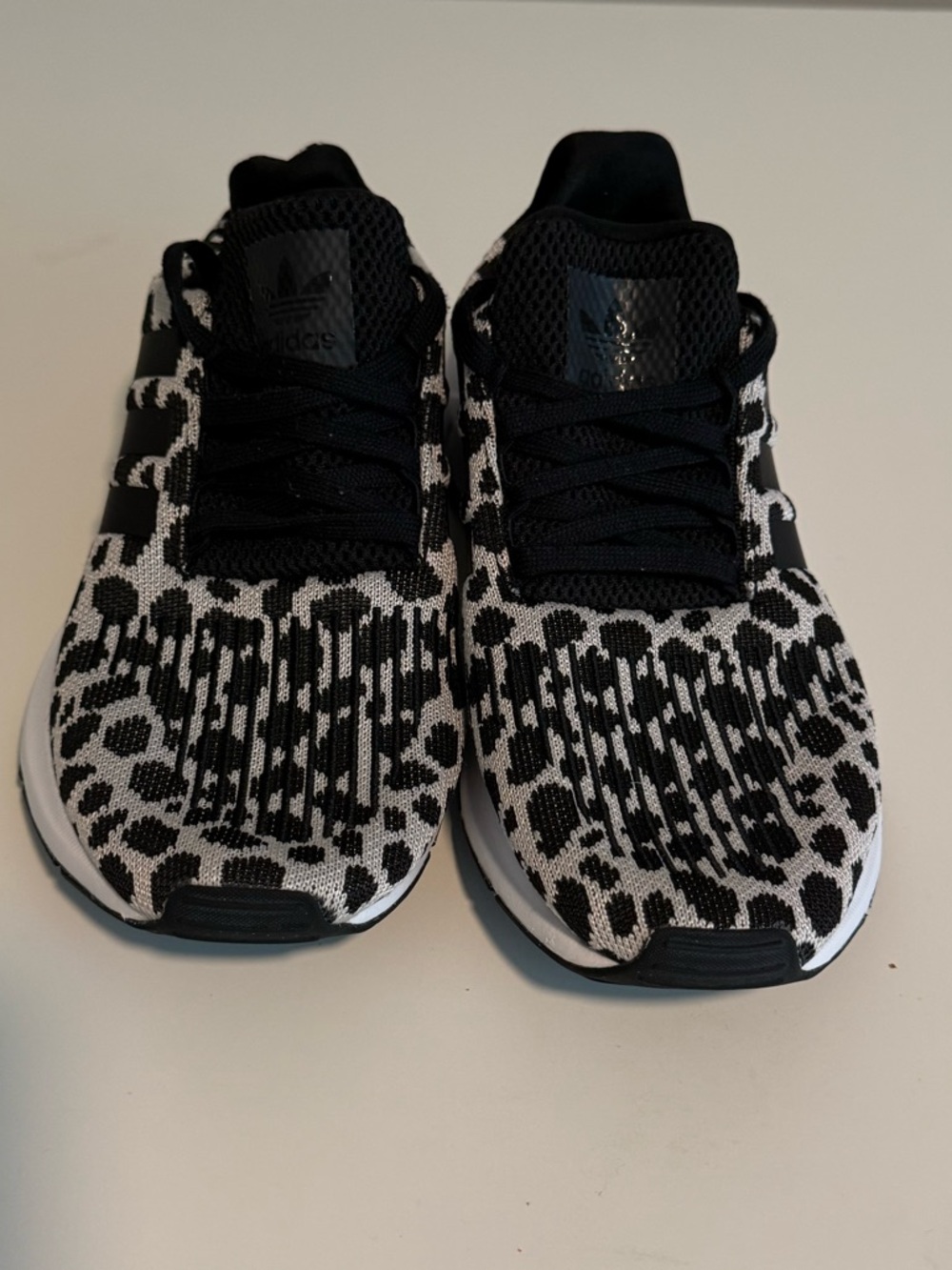 Black and White Adidas sneakers